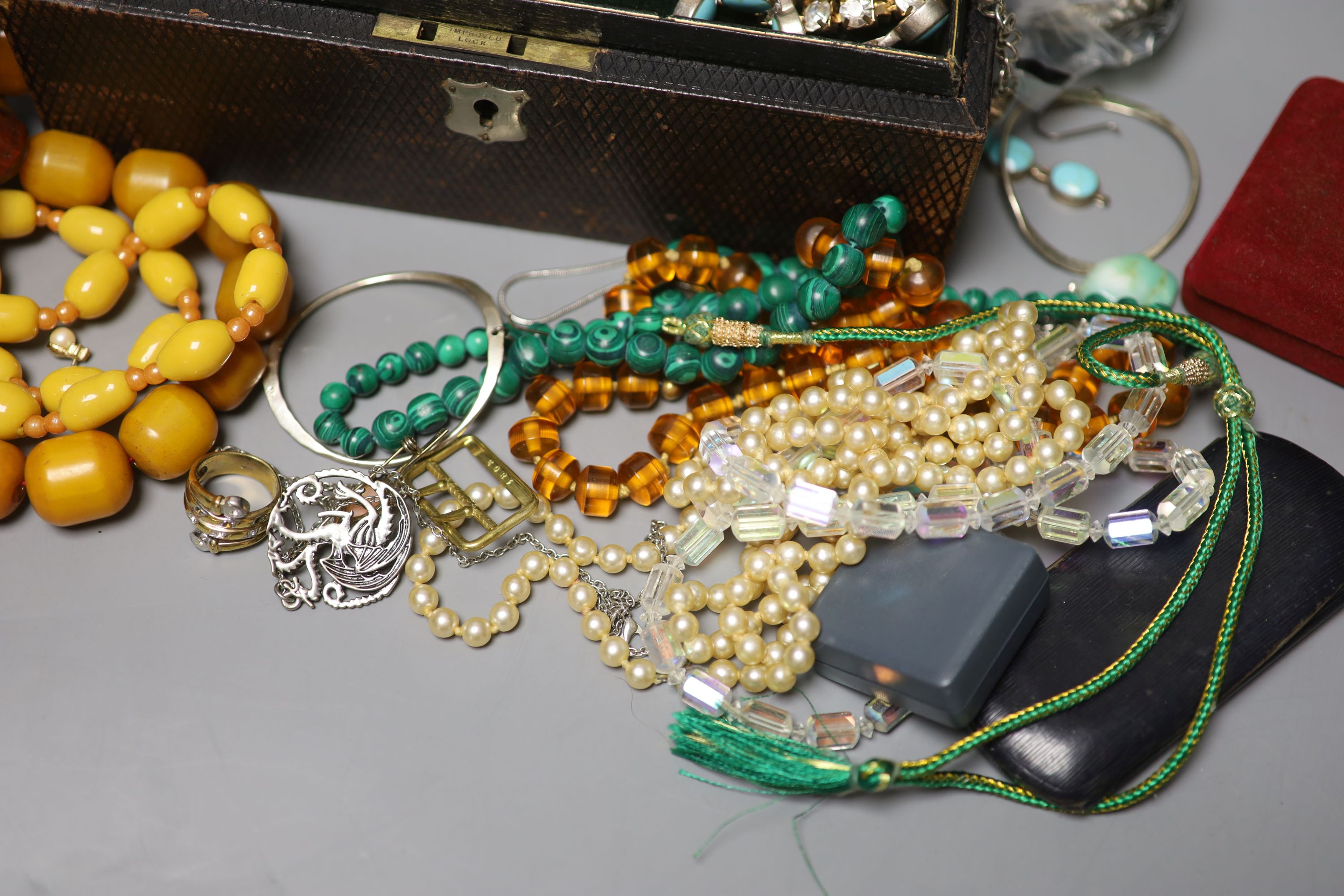 A mixed quantity of assorted mainly costume jewelley including amber necklace, malachite necklace, 925 and turquoise bracelet etc.